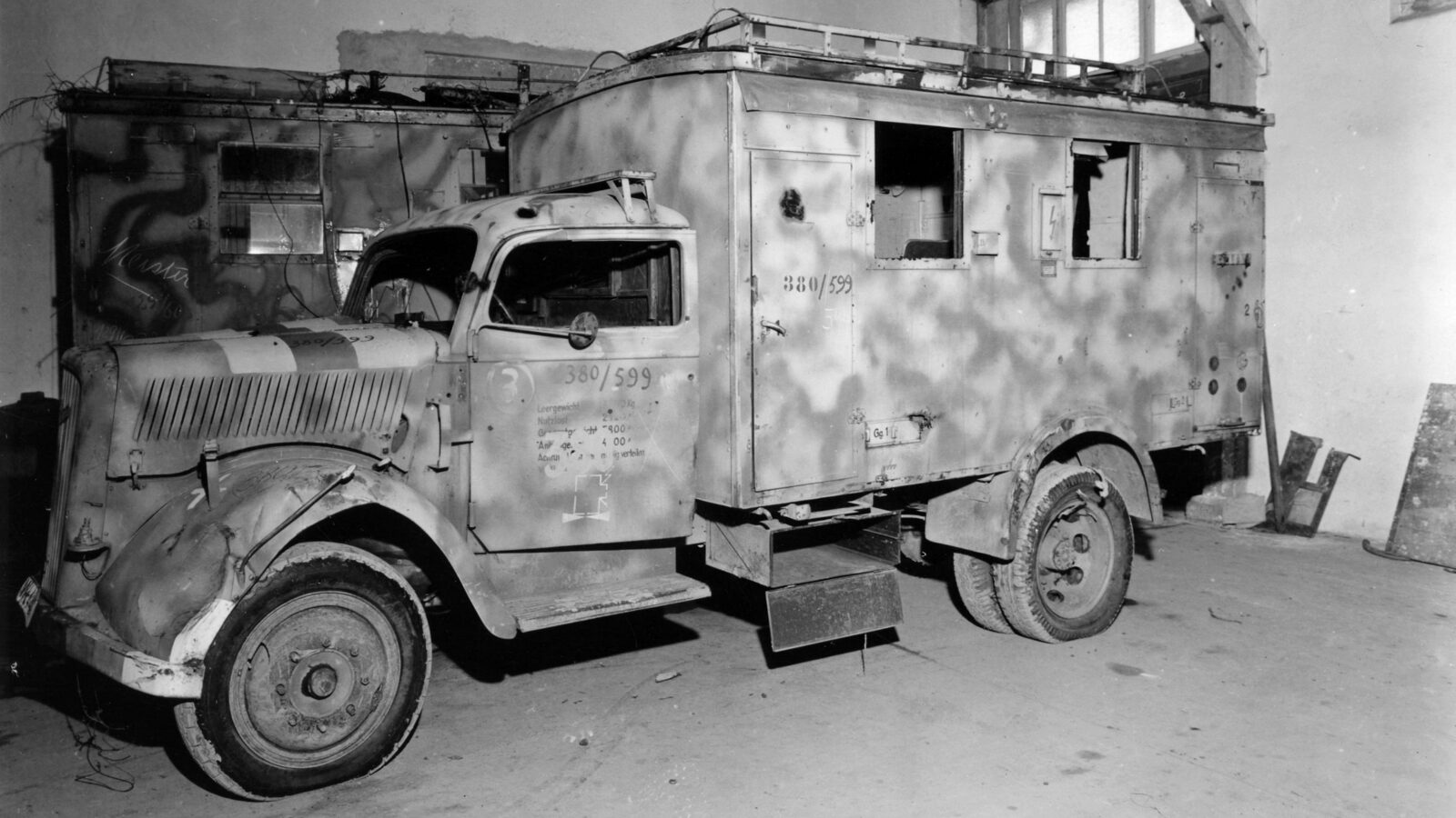 Workers rebuild a damaged truck at the Steyr works in occupied Vienna, December 1945.