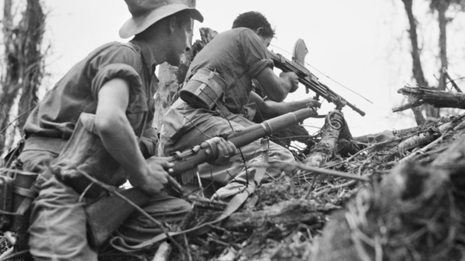 Australian 2/8th Battalion Bren gun team firing on Japanese positions near Wewak, New Guinea, June 1945