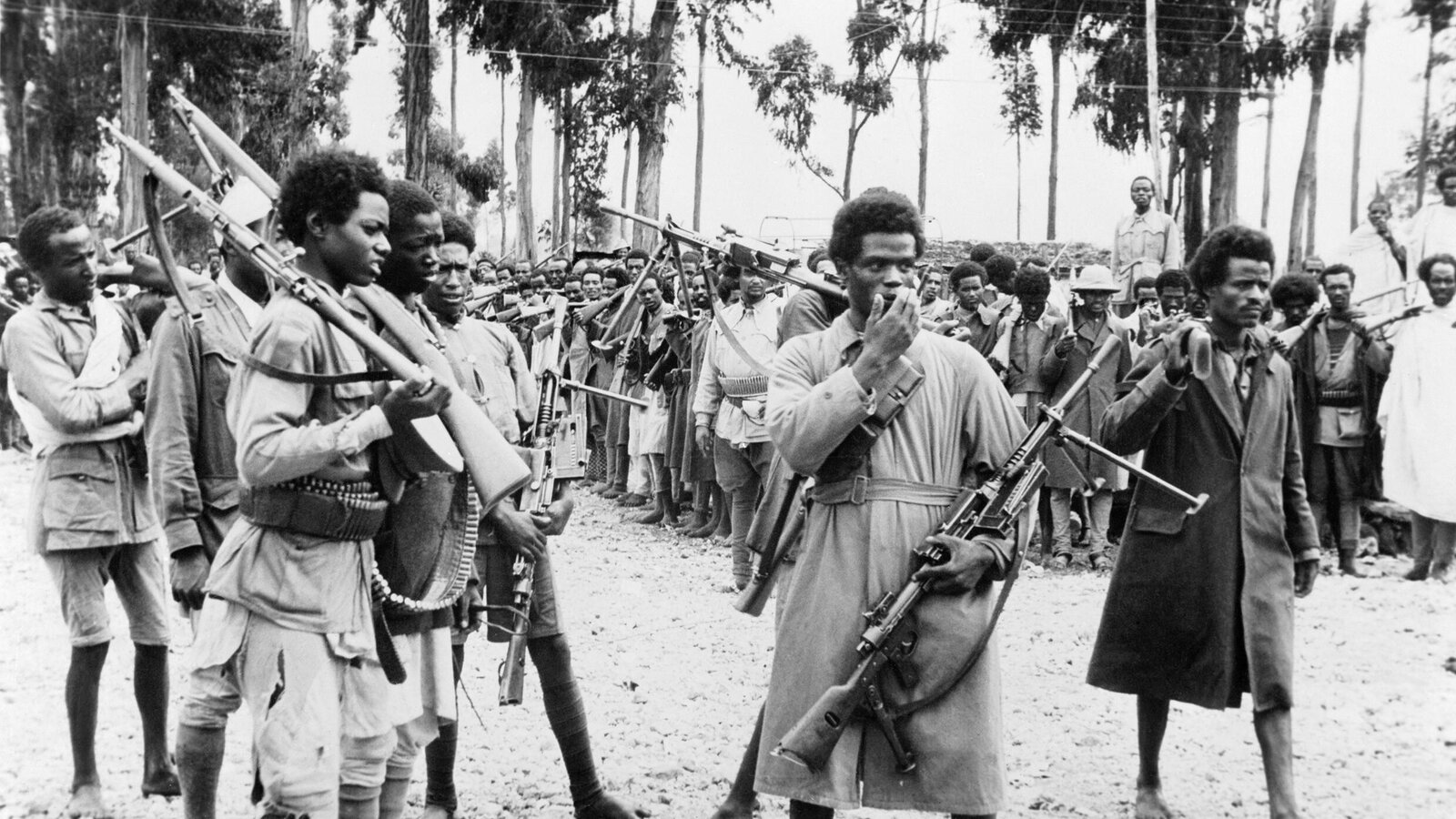 Ethiopian fighters armed with captured Italian weapons gathered in Addis Ababa in May 1941 to hear the proclamation announcing Emperor Haile Selassie's return to the capital after the Allied liberation