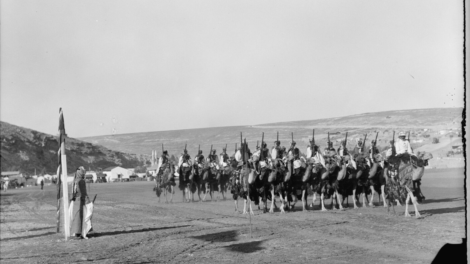 The Camel Corps of the Arab Legion drawn up on parade outside Amman, Transjordan, 1935