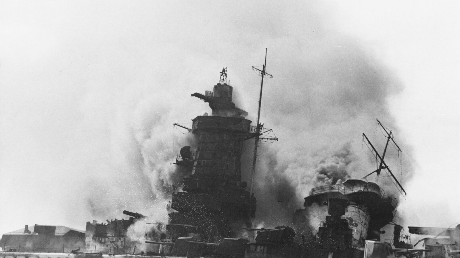 The German pocket battleship Admiral Graf Spee burning in the Río de la Plata estuary off Montevideo, Uruguay, after being scuttled by her own crew on 17 December 1939