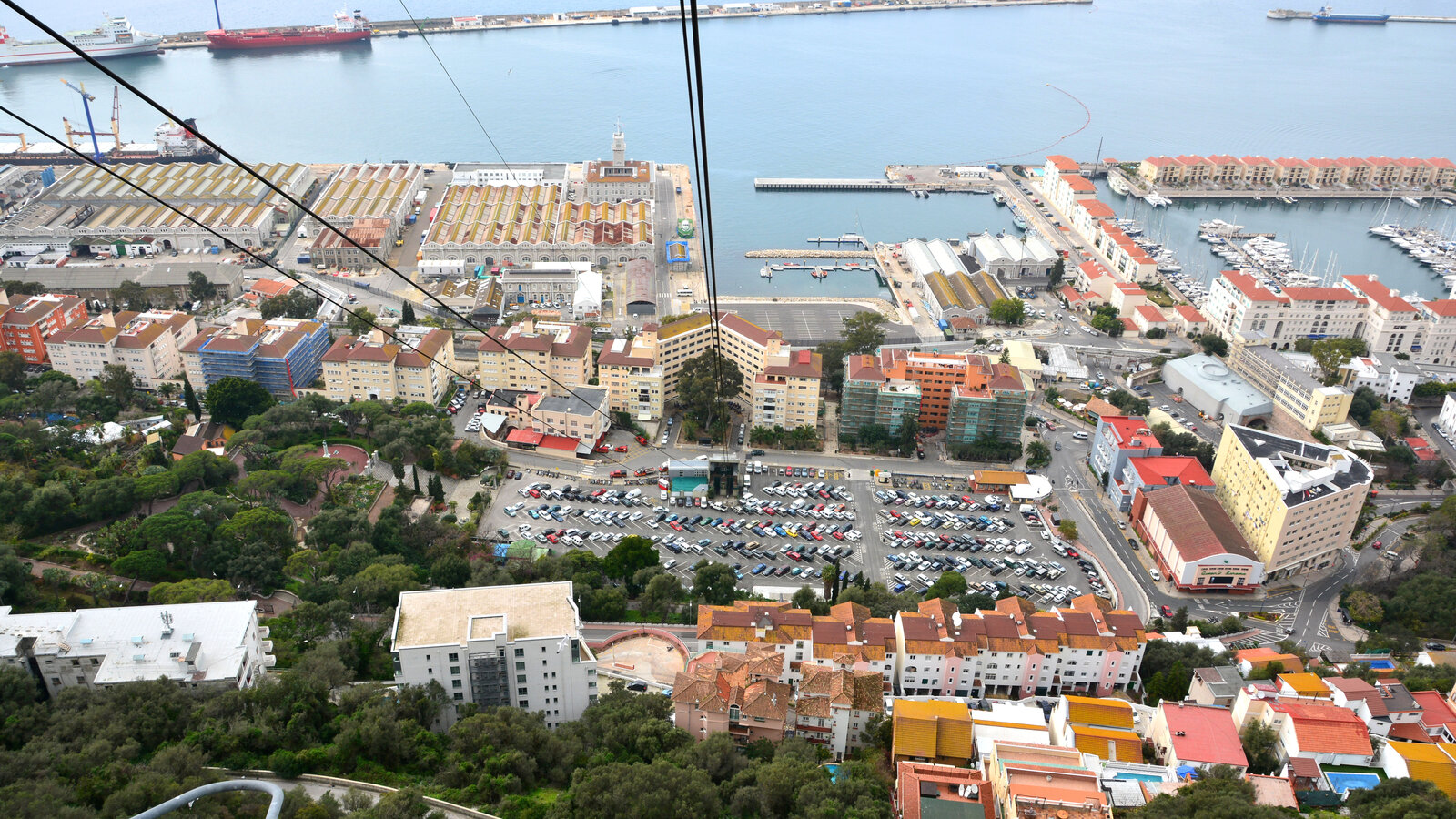 Aerial view of Gibraltar from the cable car descending The Rock, showing the old military harbour and town built on reclaimed land, February 2014