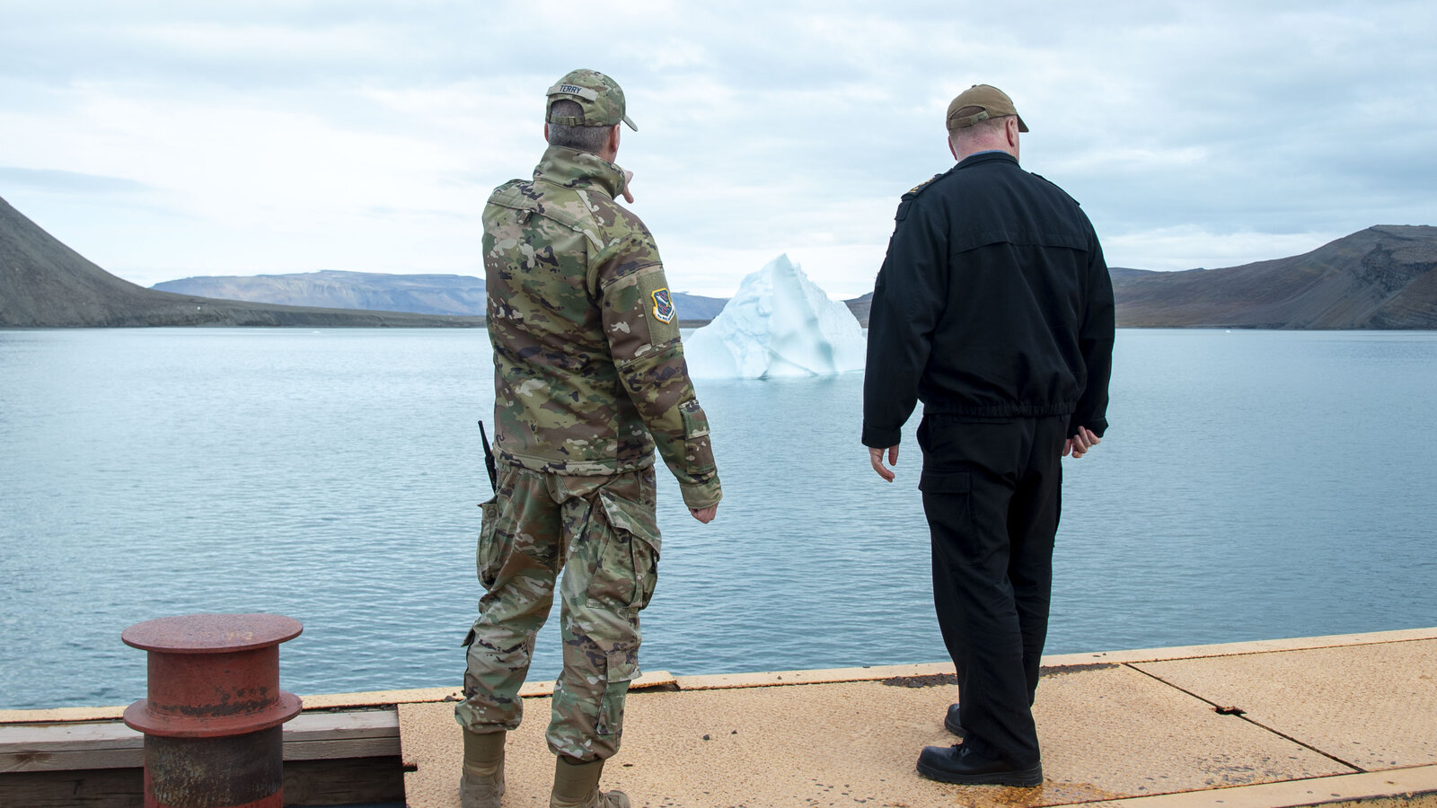 Canadian Rear Adm. David Patchell and U.S. Space Force Col. Jason Terry discuss Arctic strategy at Pituffik Space Base, Greenland, August 2023