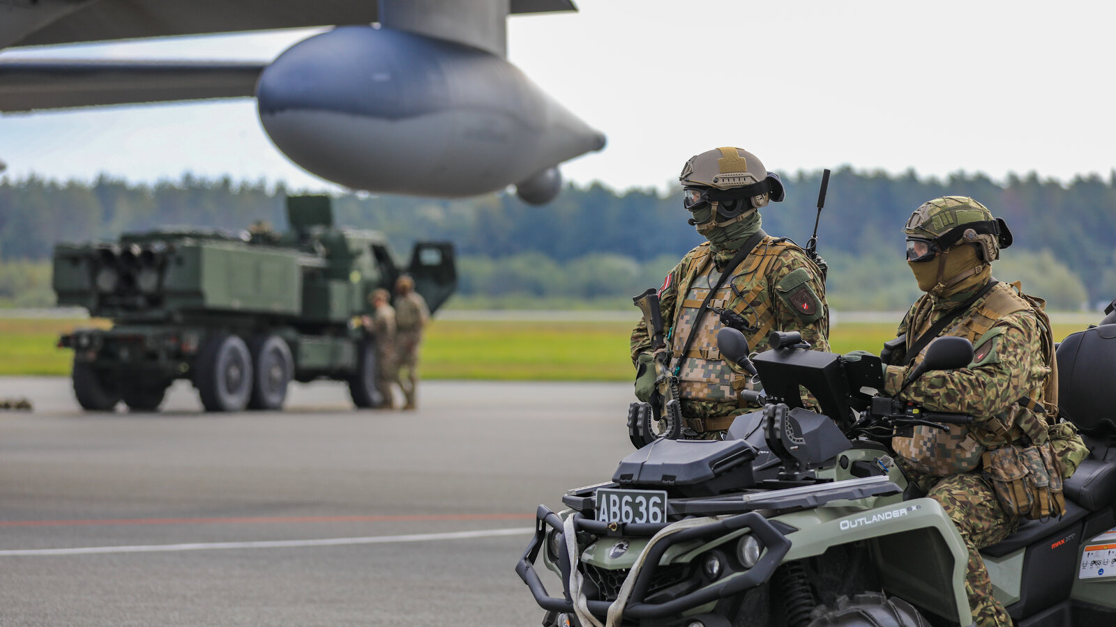 Latvian National Armed Forces soldiers provide force protection for a U.S. M142 HIMARS during NAMEJS Exercise 2022 at Liepāja, Latvia, September 2022