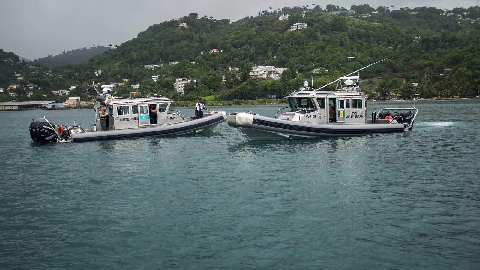 St. Vincent and the Grenadines and St. Lucia coast guard interceptors pass each other near Castries during TRADEWINDS 2013, May 2013