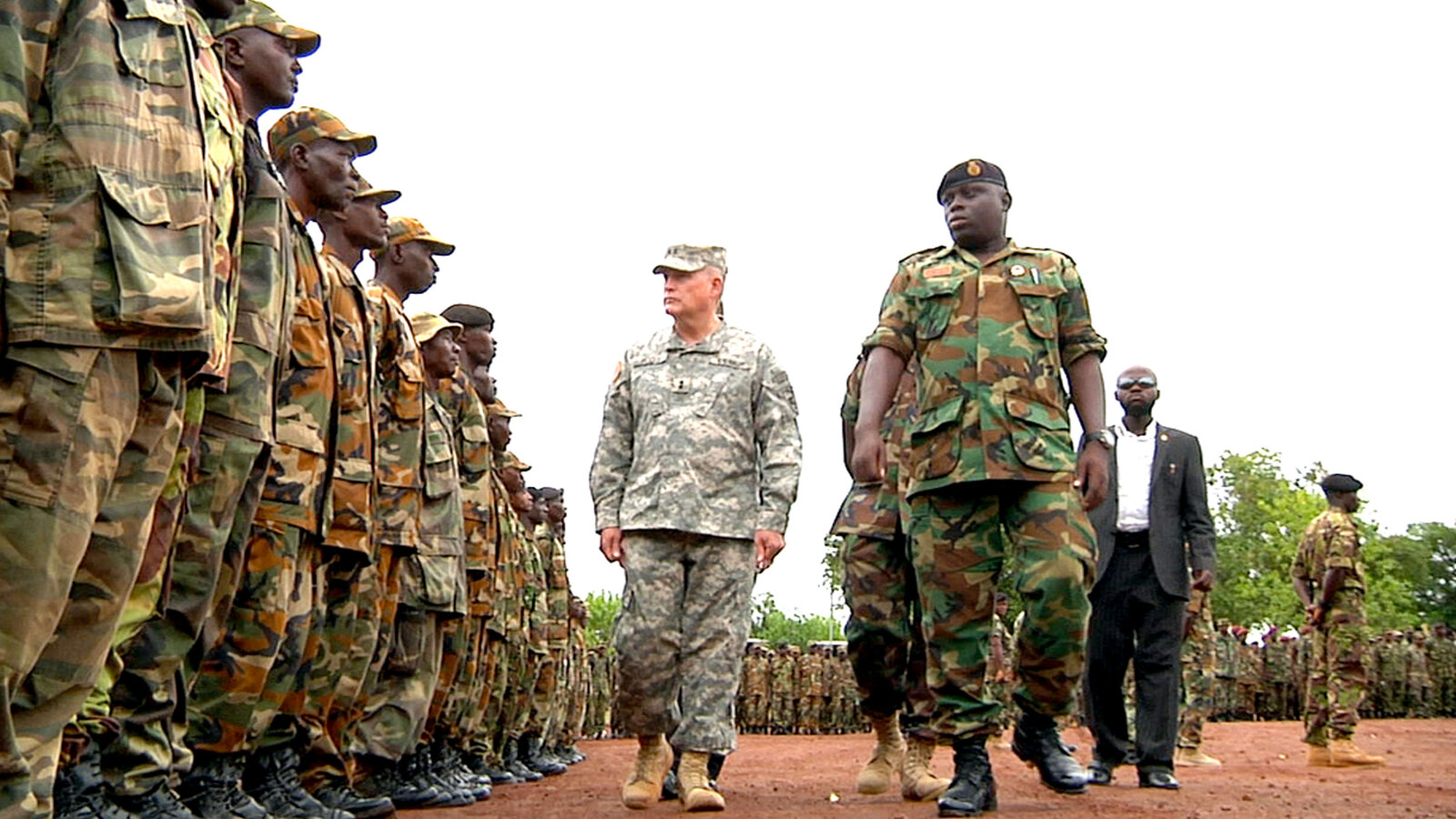 Major General David R. Hogg and Lt. Col. A.B. Conteh inspect Sierra Leone troops at a deployment ceremony for AMISOM, May 2012